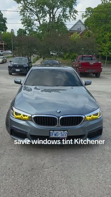 Grey BMW sedan parked outside Saviz Window Tinting
